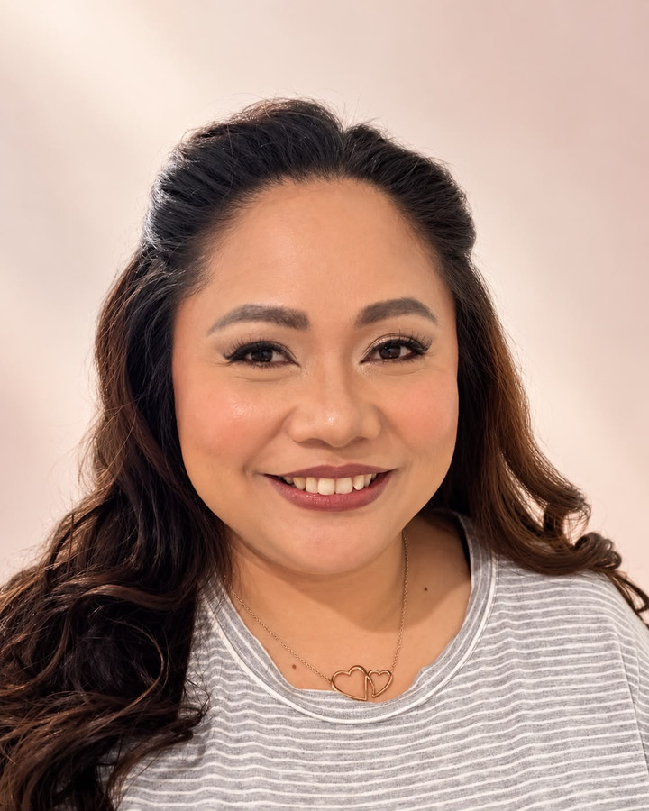 Natural glam: a skin-like base and a muted rose lip, smiling