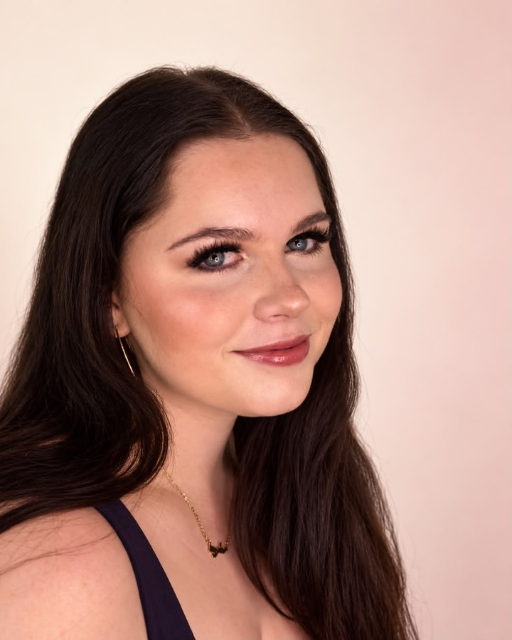 Soft glam in the studio: lashes, blush and a rose lip, three-quarter view